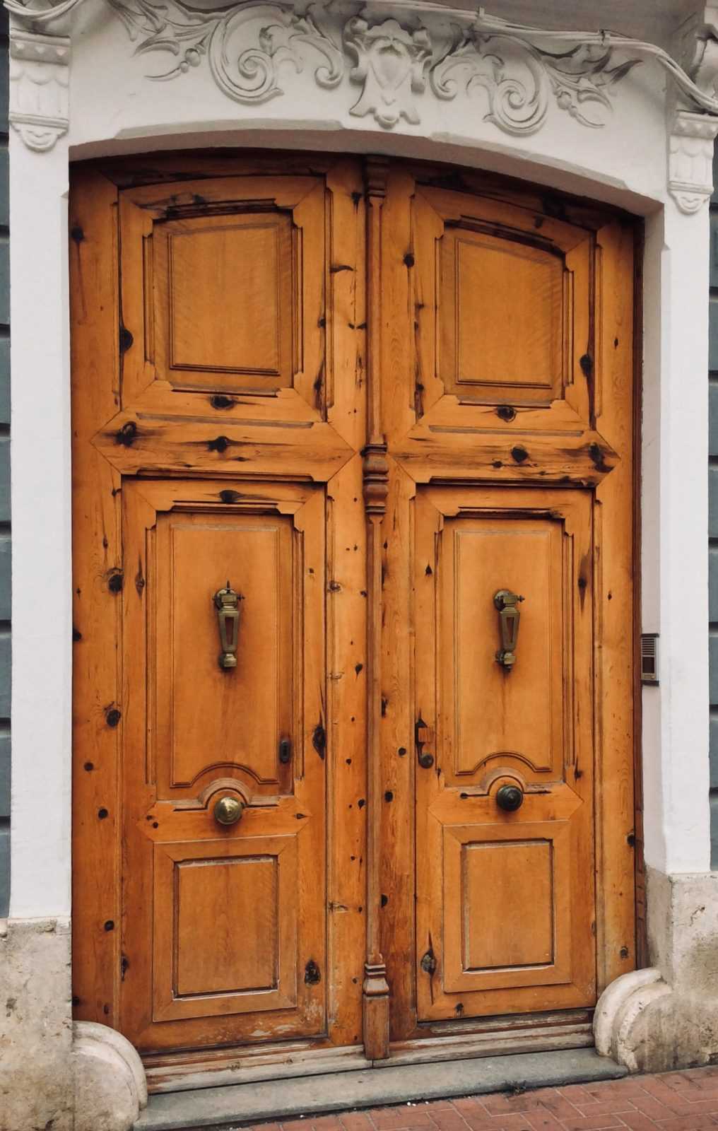 Carved wooden door in Oliva, Valencia, Spain
