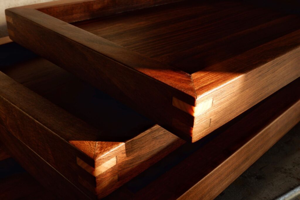 Walnut tray with cedar made by artisans of the Estudio Sangiovanni in Galicia, Spain for Lorenzo Design.